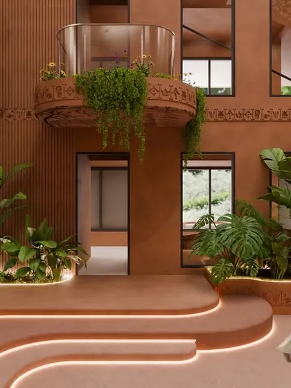 The central courtyard, with its terracotta walls and intricate Kalamkari detailing, is the heart of the design. Balconies spill over with lush greenery, softening the lines and creating a rhythm of nature against earth.