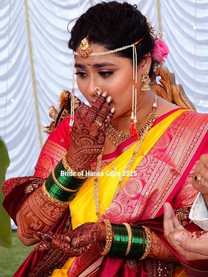 An emotional moment for the bride. This candid shot captures the mix of joy and sentimentality that every bride feels on her wedding day, with her mehendi as a silent witness.