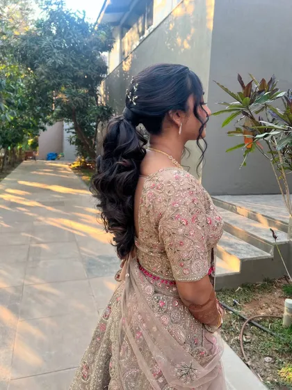 The client looking beautiful and confident with her romantic ponytail.