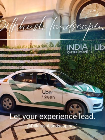 An "Uber Green" electric vehicle displayed in front of a custom living wall we created for the launch event. The installation provides a lush, on-brand photo opportunity.