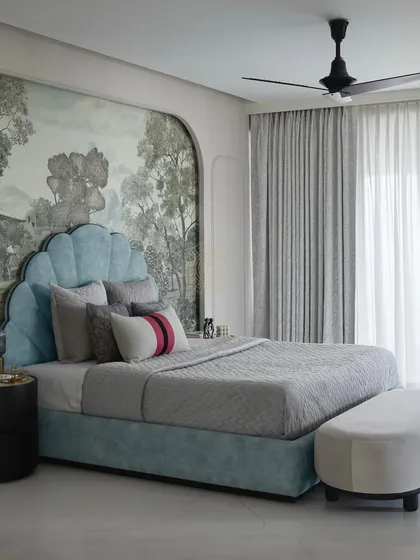 A full view of the daughter's bedroom, showing the arched wallpaper panel and the elegant grey curtains. The space is a perfect mix of bold design choices and serene, comfortable elements.