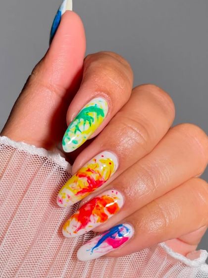 Celebrate Holi with a splash of color on your nails! This vibrant watercolor splash design is the perfect way to get into the festive spirit.