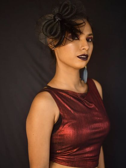 This look is all about attitude. The dark lipstick and bold eyes create a strong, editorial feel perfect for a photoshoot.