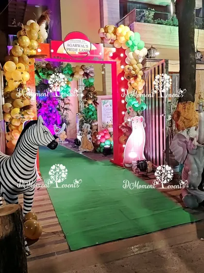 The final look of the grand jungle entrance, guarded by realistic 3D zebra and elephant statues.