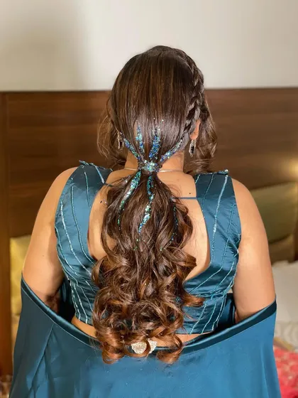 The finished look is a perfect party ponytail. It's stylish, glamorous, and guaranteed to catch the light on the dance floor.