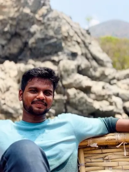 Taking a moment to relax during the coracle boat tour at Hogenakkal falls.