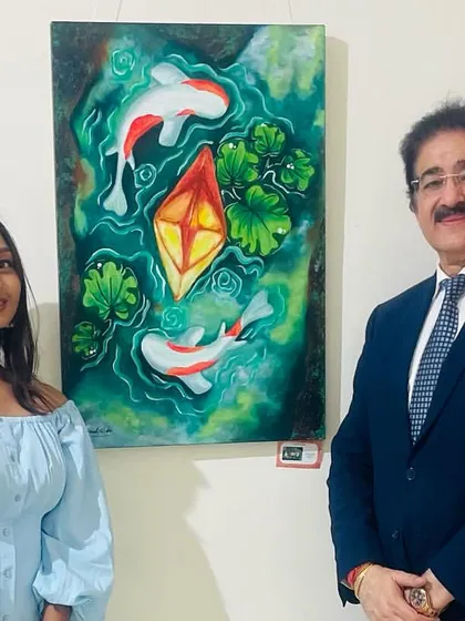 Sharing a moment with a visitor at the Lokayata Art Gallery in front of my "Koi Fish" painting. Every exhibition is a great experience, connecting with new people and fellow artists.