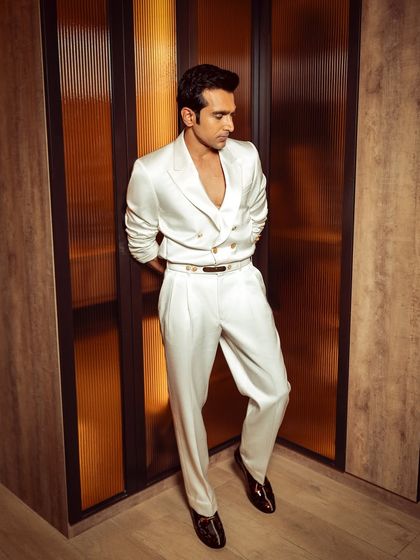 Pratik Gandhi looking sharp and confident in our bespoke white suit. The tailoring is designed to complement his modern charm and timeless class.