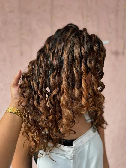 A close-up of the caramel curls, showing the beautiful shine and healthy look of this non-bleach color.
