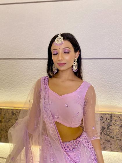 A close-up of the bridesmaid's makeup, showing the pretty pastel eyeshadow and the flawless skin finish.