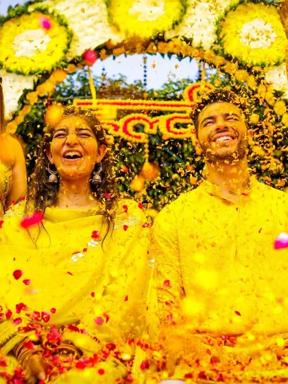The pure joy and fun of a Haldi ceremony, as the couple is showered with flower petals by their friends and family. We aim to capture the high energy and candid laughter of these moments.