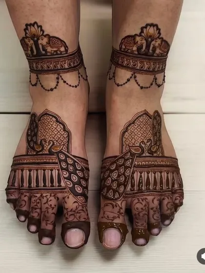 Your feet deserve just as much attention. This elegant foot mehndi showcases my skill with symmetrical patterns, featuring graceful peacocks and royal elephants, perfect for completing your bridal henna.