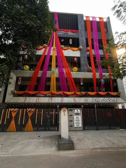A full view of the building's daytime decor. I also decorate the main gate with matching drapes and marigold garlands to welcome your guests properly.