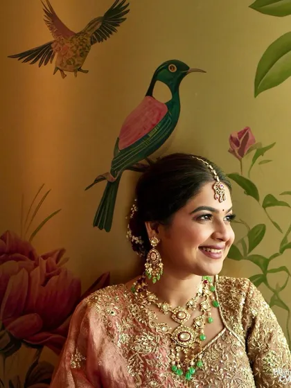 A close-up of my best friend's bridal look. The soft, warm tones on her eyes and cheeks against the artistic wallpaper create such a beautiful, painterly effect.