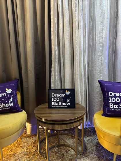 The complete studio setup for the 'Dream 100 Biz Show', featuring the two logo-embroidered cushions I created for them.