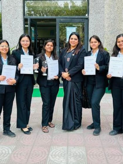 Celebrating with the winning all-female team of the moot court competition. Their victory is a powerful statement and an inspiration for other young women entering the legal field.