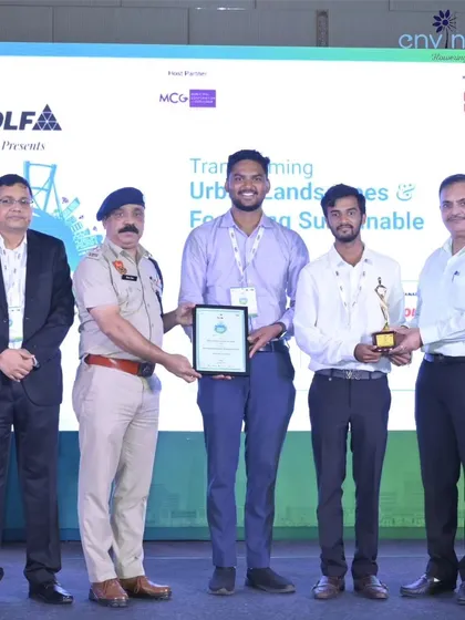 Receiving the Elets Innovation Award on stage from Hon'ble Dr. Narhari Banger and DCP Mr. Vijendra Vig. This recognition strengthens our resolve to drive positive change through clean energy solutions.