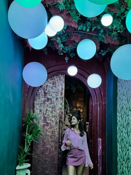 Exploring the aesthetic interiors of a new restaurant. This monochrome pink look, with a light pink shirt and a darker pink mini skirt, is playful and chic.