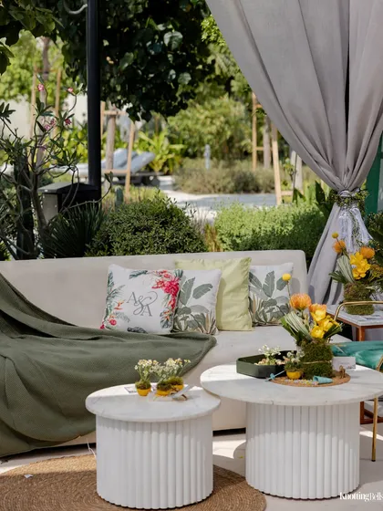 A comfortable and stylish lounge seating area for guests. The custom cushions and soft throws create an inviting space for guests to relax and mingle.