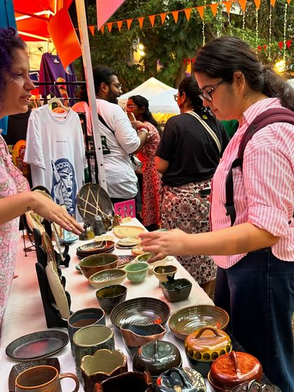 Explaining the process behind a particular piece to an interested visitor. I'm always happy to share the stories behind my work and the techniques I use to create my studio pottery.