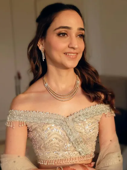 Different angles of this romantic half-up, half-down hairstyle. The soft waves and simple twist at the crown create a look that is both modern and timeless.