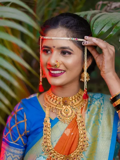 I believe every Maharashtrian bride is a work of art. In this portrait, I focused on the beautiful details of her look, from the traditional mundavalya and gold jewellery to her happy, confident smile. Creating these classic bridal portraits is one of my favorite parts of the wedding day.
