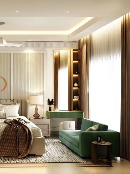 A calm and classy bedroom with a soothing neutral palette, a comfortable green sofa, and a sleek vanity area with a backlit mirror.