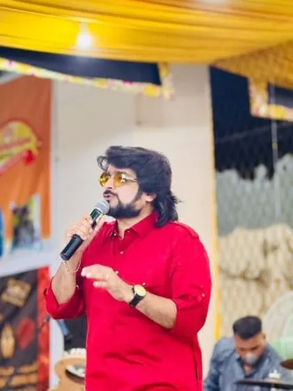 On stage, microphone in hand, during the Navratri festival in Muscat. This is where I feel most alive.
