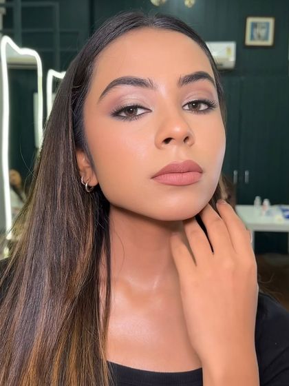 A close-up on an effortless, flawless, and modern makeup look. The matte brown smokey eye and nude lip is a timeless combination that suits everyone.