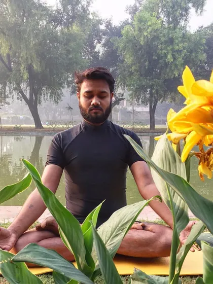 Meditation is the foundation of Yognaman. Here, I am in Padmasana (Lotus Pose) by the water, connecting with my breath and the stillness of nature. This practice is about finding the calm center within you, no matter the world outside.