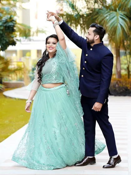 Another angle of the couple's dance, showing the beautiful movement of the bride's lehenga and her happy expression.