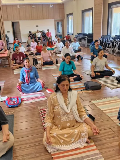 Participants in our Pranayama workshop are fully engaged in a guided meditation. These sessions help integrate the theoretical knowledge with direct experience, leading to a deeper understanding of breathwork.