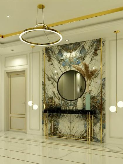 A slightly different angle of the lobby, emphasizing the circular chandelier and the brass inlay details in the ceiling.