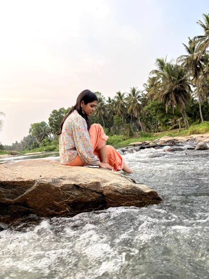 Dipping my feet in the cool, flowing water. Engaging all the senses is a key part of connecting with a place.