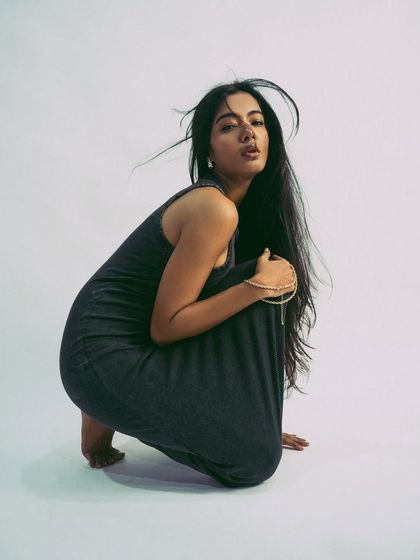 A strong, crouching pose that is both grounded and full of potential energy.