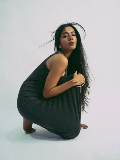 A strong, crouching pose that is both grounded and full of potential energy.