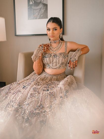This princess-like sangeet look is all about elegance. You'll learn to create a sharp, high ponytail and a sophisticated makeup look to match a dreamy ballgown.