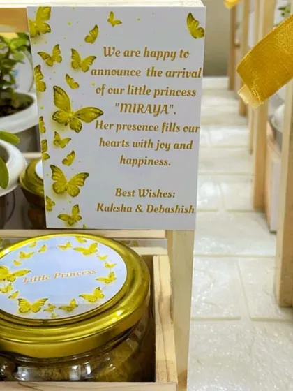 It's all in the details. This close-up shows the personalized announcement card for baby Miraya, featuring a beautiful butterfly theme that coordinates with the entire gift basket. I can customize every element to match your vision.