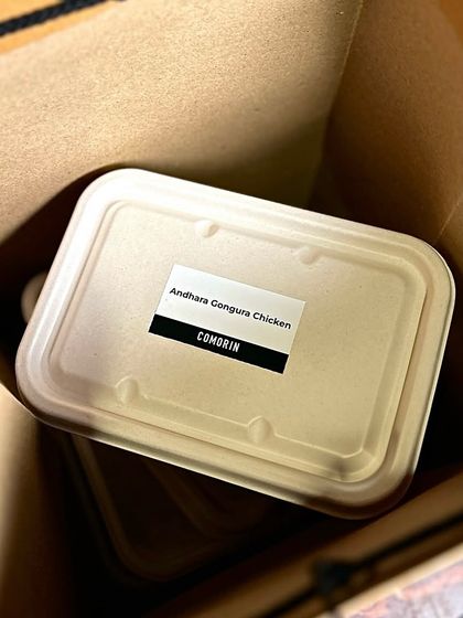 Your order of Andhra Gongura Chicken, sealed and labeled. We take pride in our clear and secure packaging, so you know exactly what you're getting.