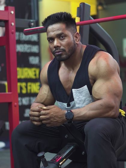 A seated pose, showing the physique even at rest.