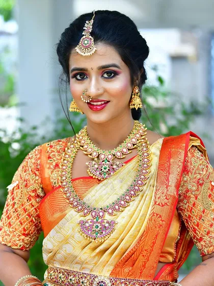 A close-up of the stunning Kemp jewellery set. The intricate details of the pendants and the vibrant colours are highlighted in this shot.