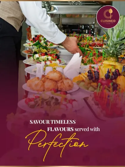 Our professional staff ensures every platter is served with perfection. Here, a waiter meticulously arranges a tray of assorted appetizers, showcasing our commitment to detail and excellent service.