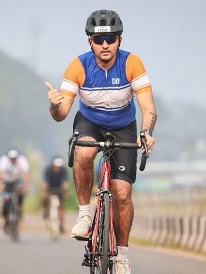 An athlete powering through the cycling leg of the Ironman 70.3. We provide specialized training for triathletes aiming for these endurance events.