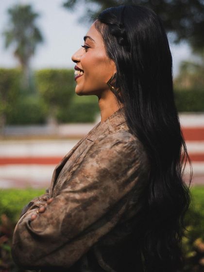 A profile shot of Anasuya Sengupta smiling. Capturing these candid, happy moments is just as important as the more posed shots.