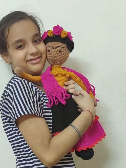 A beautiful moment of a young girl hugging her new Frida Kahlo doll. My dolls are made to be cherished companions for years to come.