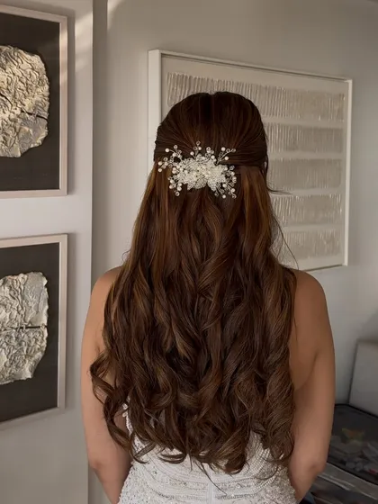 The same elegant hairstyle from a slightly different angle, showing how the accessory sits perfectly at the crown.