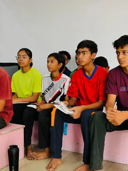 Our young cadet athletes listening intently during a mindset training session, absorbing valuable lessons for their journey.