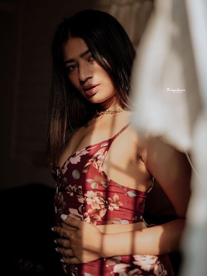 This shot is all about the mood. The soft light, the pose, and the expression come together to create a sensual and artistic image.