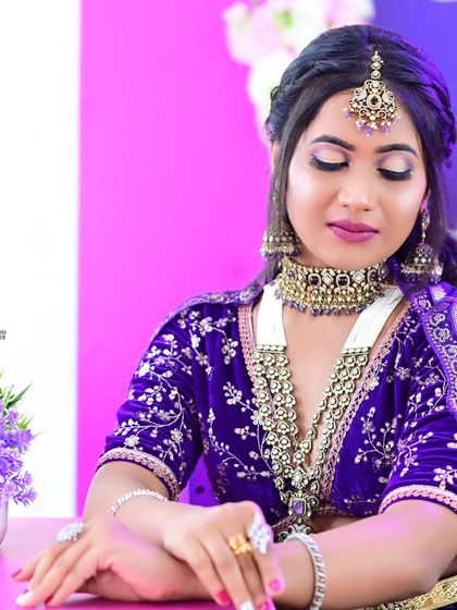 Photos from a makeup class portfolio, where the model is wearing our purple Victorian bridal set with a matching lehenga.