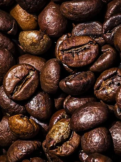 A macro shot of roasted coffee beans. I love getting up close to show the texture, oils, and unique characteristics of each bean.